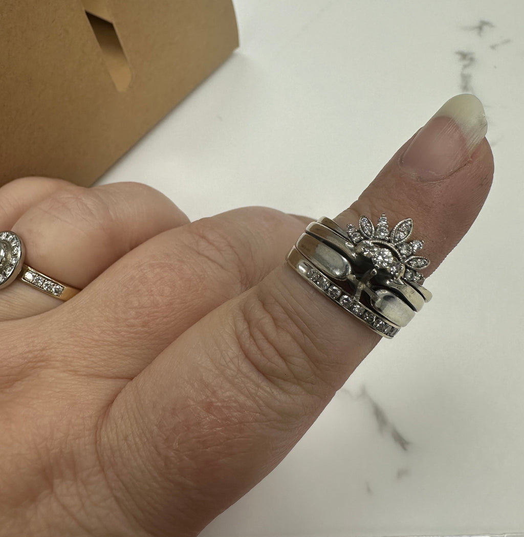 Completely new centre setting on engagement ring, set centre stone, all prongs on ring attached to engagement ring retipped, polish and rhodium + polish and rhodium two additional bands. | Adriana McNeely Designer & Goldsmith