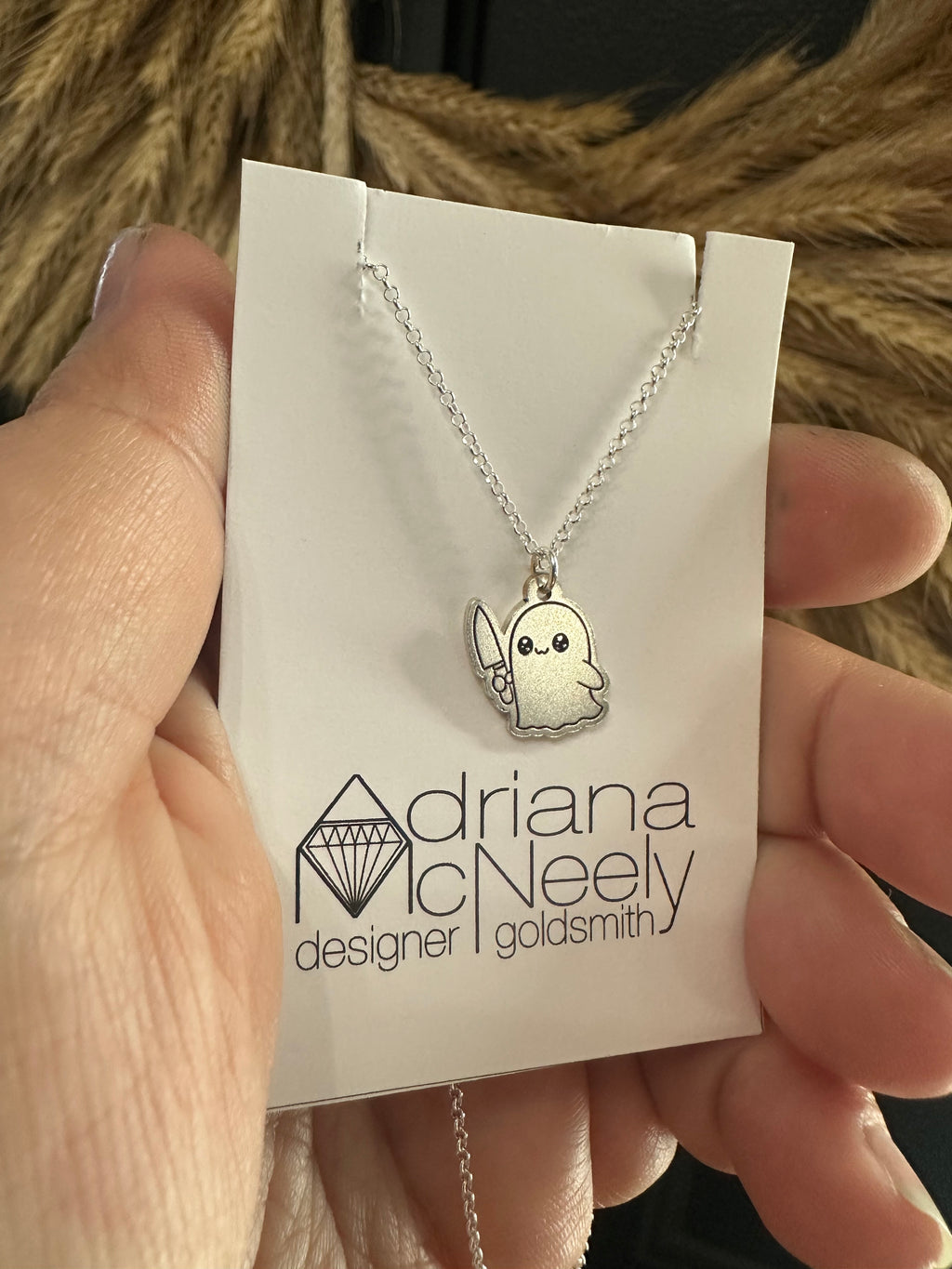 Ghost with knife pendant