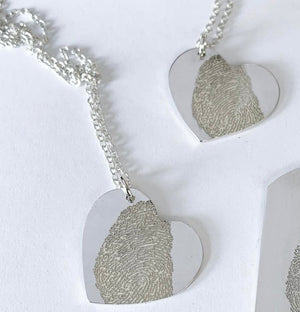 Engraved fingerprint heart pendant on chain | Adriana McNeely Designer & Goldsmith